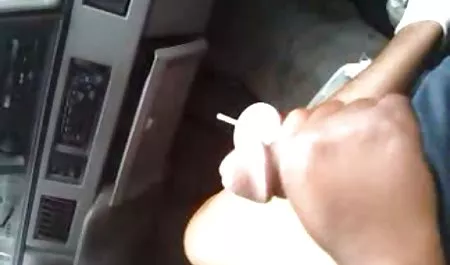 The lady sucks up standing member under close-up on a video camera